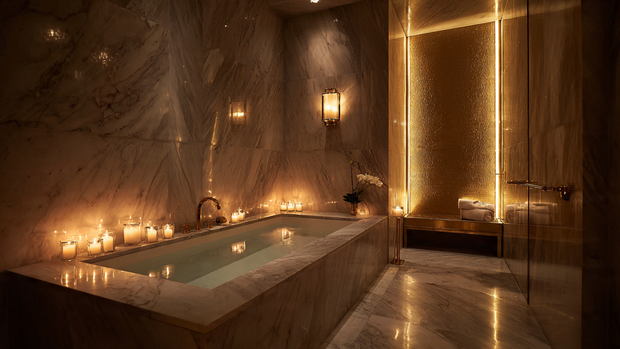 16 Luxurious Bathroom Design Ideas for a Spa-Like Retreat 4 Luxury bathroom with layered ambient lighting and warm, relaxing tones.