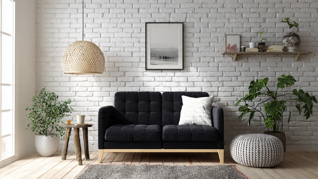 12 Stunning Black Couch Living Room Ideas with Style 11 Compact minimalist living room with black loveseat and white brick accent wall.