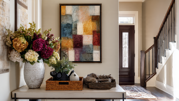 16 Functional Entryway Organization Tips for Everyday Living 14 Personalized entryway with wall art and decorative accents creating a warm welcome.