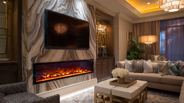 A modern living room with an electric fireplace beneath a sleek TV wall for warmth and style.