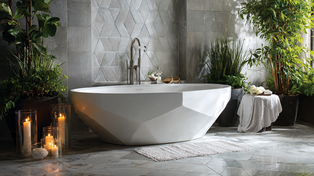 16 Luxurious Bathroom Design Ideas for a Spa-Like Retreat 3 Elegant freestanding bathtub surrounded by candles and soft neutral tones.
