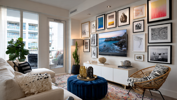 A modern living room TV wall incorporated into a stylish gallery wall design.