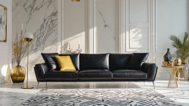 12 Stunning Black Couch Living Room Ideas with Style 2 Minimalist living room with black leather couch, gold accents, and white marble flooring.