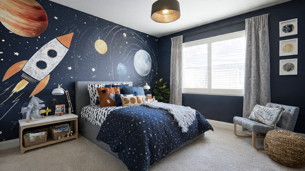 16 Whimsical Kids Room Ideas to Brighten Your Home Decor 3 Space-themed kids room with planet murals, navy blue walls, and rocket bed.