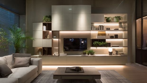 Built-in modern TV wall with storage cabinets, open shelving, and LED accent lighting.